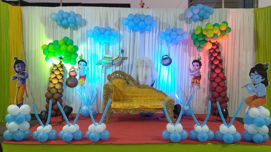 Immersive Bal Krishna Kanha garden-themed naming ceremony stage in Jaipur with balloon trees and cloud ceiling by Shava Moments.