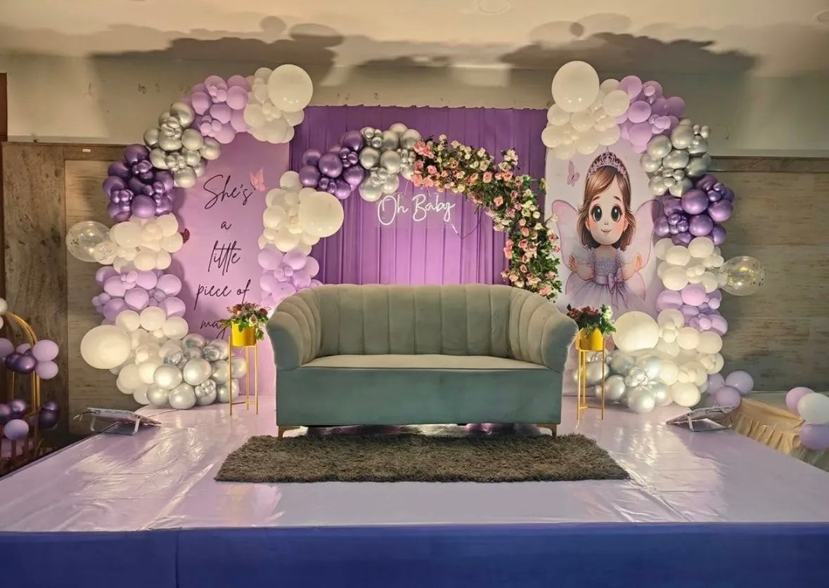 Elegant purple and white fairy themed naming ceremony stage decor in Jaipur with neon lighting by Shava Moments