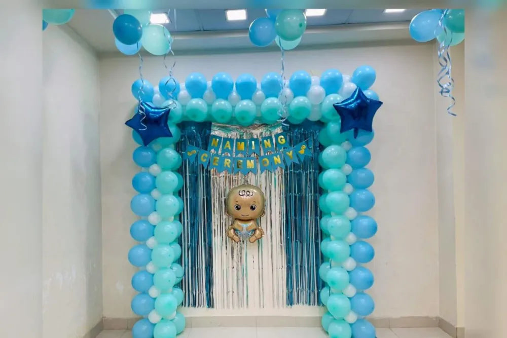 Light blue and white square balloon frame for a naming ceremony in Jaipur with silver tinsel backdrop and star balloons by Shava Moments